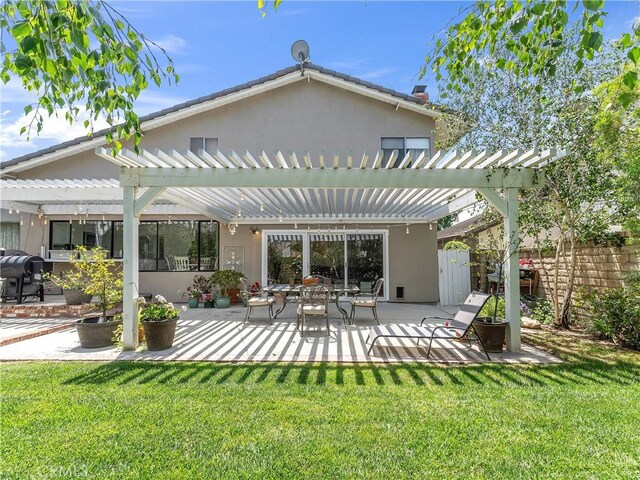 23403 Via Castanet, Valencia, CA 91355 - back of house featuring a pergola, a patio, and stucco siding