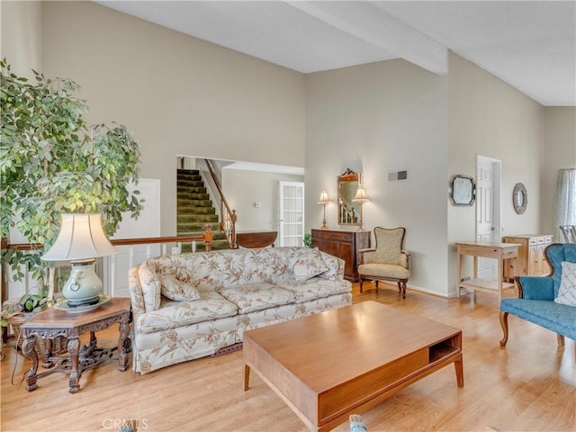23403 Via Castanet, Valencia, CA 91355 - living room with high vaulted ceiling, stairs, wood finished floors, beam ceiling, and baseboards