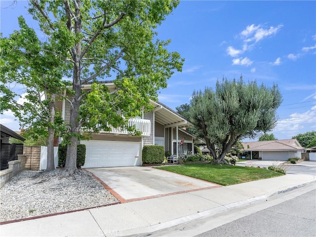 23403 Via Castanet, Valencia, CA 91355 - obstructed view of property with concrete driveway and a garage