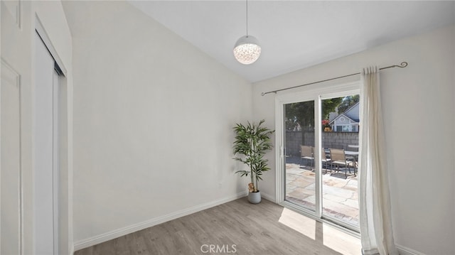 10133 Shinon Dr, Rancho Cucamonga, CA 91737 - empty room featuring light wood-style floors, baseboards, and vaulted ceiling
