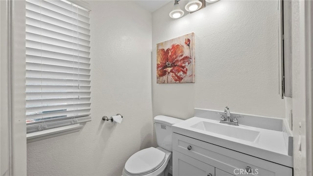 10133 Shinon Dr, Rancho Cucamonga, CA 91737 - bathroom with toilet, vanity, and a textured wall