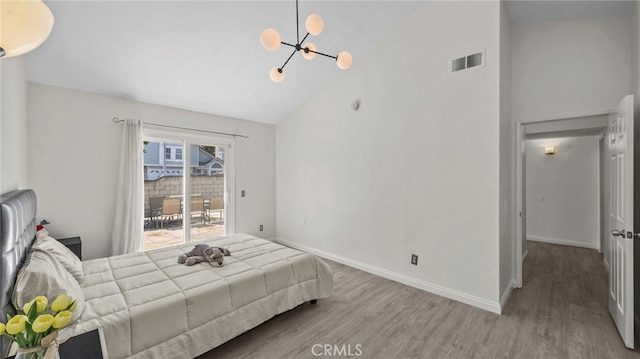 10133 Shinon Dr, Rancho Cucamonga, CA 91737 - bedroom with high vaulted ceiling, a chandelier, wood finished floors, access to exterior, and baseboards