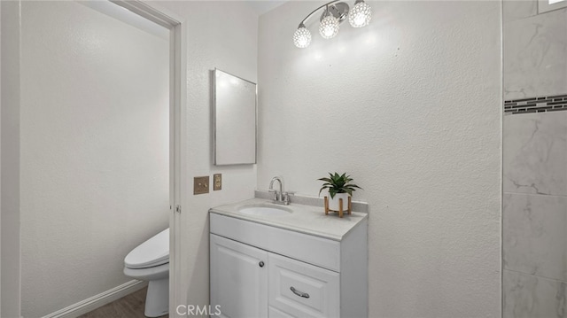 10133 Shinon Dr, Rancho Cucamonga, CA 91737 - bathroom featuring toilet, vanity, and wood finished floors
