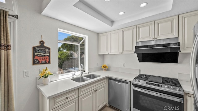 10133 Shinon Dr, Rancho Cucamonga, CA 91737 - kitchen featuring appliances with stainless steel finishes, a sink, light countertops, range hood, and recessed lighting
