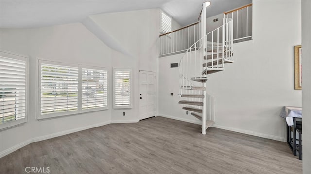 10133 Shinon Dr, Rancho Cucamonga, CA 91737 - entryway featuring wood finished floors, stairway, high vaulted ceiling, and baseboards