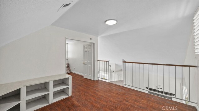10133 Shinon Dr, Rancho Cucamonga, CA 91737 - hallway with lofted ceiling, wood finished floors, and an upstairs landing