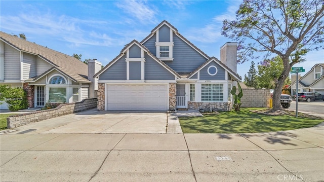 10133 Shinon Dr, Rancho Cucamonga, CA 91737 - view of front facade featuring a chimney, stone siding, concrete driveway, and a front yard