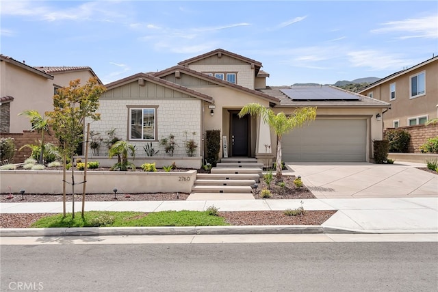 2760 Chad Zeller Ln, Corona, CA 92882 - view of front facade featuring roof mounted solar panels, a garage, and concrete driveway