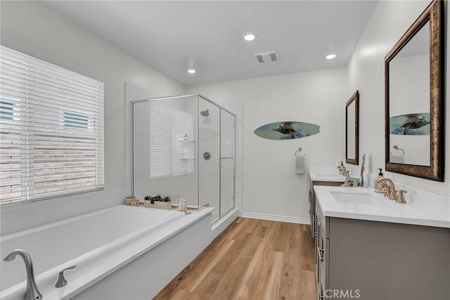 2760 Chad Zeller Ln, Corona, CA 92882 - full bathroom with a shower stall, double vanity, a garden tub, wood finished floors, and recessed lighting