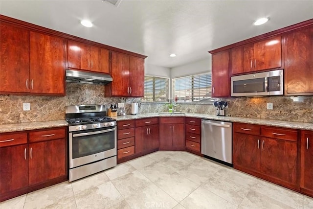 3275 Dalhart Ave, Simi Valley, CA 93063 - kitchen with stainless steel appliances, under cabinet range hood, dark brown cabinets, and recessed lighting