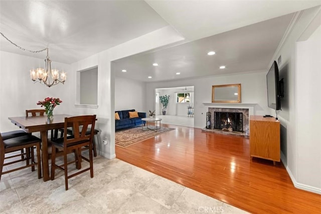 3275 Dalhart Ave, Simi Valley, CA 93063 - dining space with a chandelier, wood finished floors, recessed lighting, baseboards, and a high end fireplace