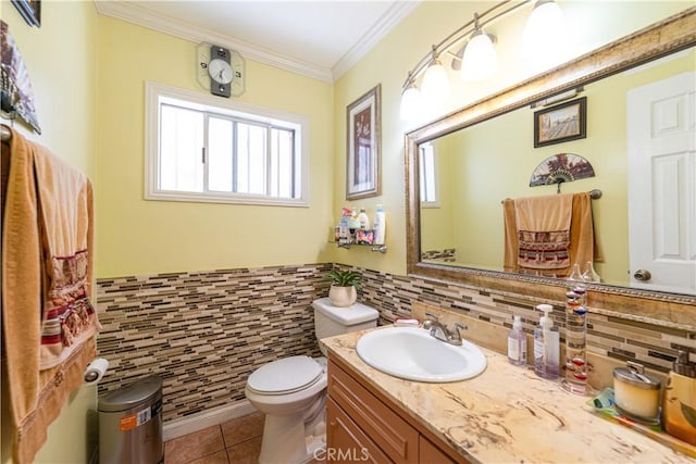 727 W Hill St, Long Beach, CA 90806 - half bath with tile patterned flooring, vanity, toilet, crown molding, and tile walls