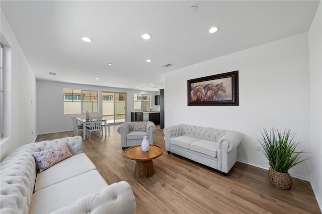 29562 Winterstorm Ct, Winchester, CA 92596 - living room featuring recessed lighting, light wood-type flooring, and baseboards