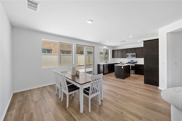 29562 Winterstorm Ct, Winchester, CA 92596 - dining area featuring healthy amount of natural light, light wood-style flooring, baseboards, and recessed lighting