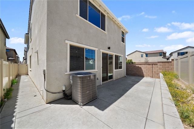 29562 Winterstorm Ct, Winchester, CA 92596 - rear view of house with cooling unit, a patio, stucco siding, and a fenced backyard