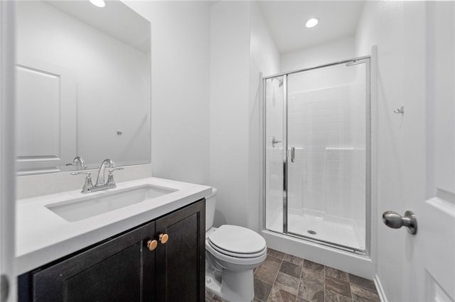 29562 Winterstorm Ct, Winchester, CA 92596 - full bath with a shower stall, vanity, toilet, stone finish floors, and recessed lighting