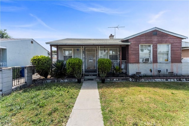 10443 E Zamora Ave, Los Angeles, CA 90002 - view of front facade featuring covered porch and cooling unit