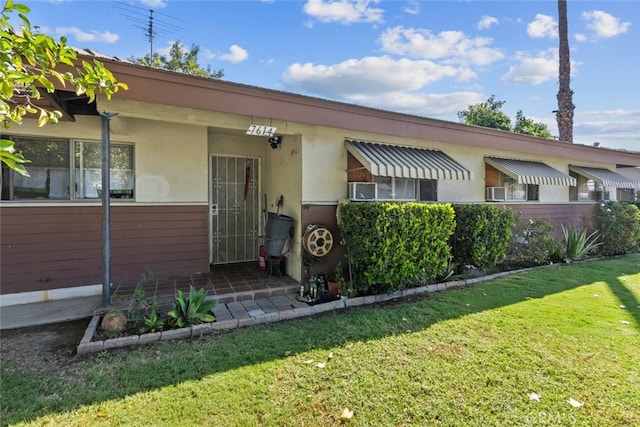 7614 Mason Ave, Winnetka, CA 91306 - view of front of house featuring a front lawn and stucco siding