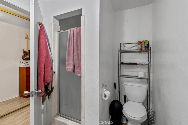 7614 Mason Ave, Winnetka, CA 91306 - full bathroom with a shower stall, wood finished floors, toilet, and baseboards