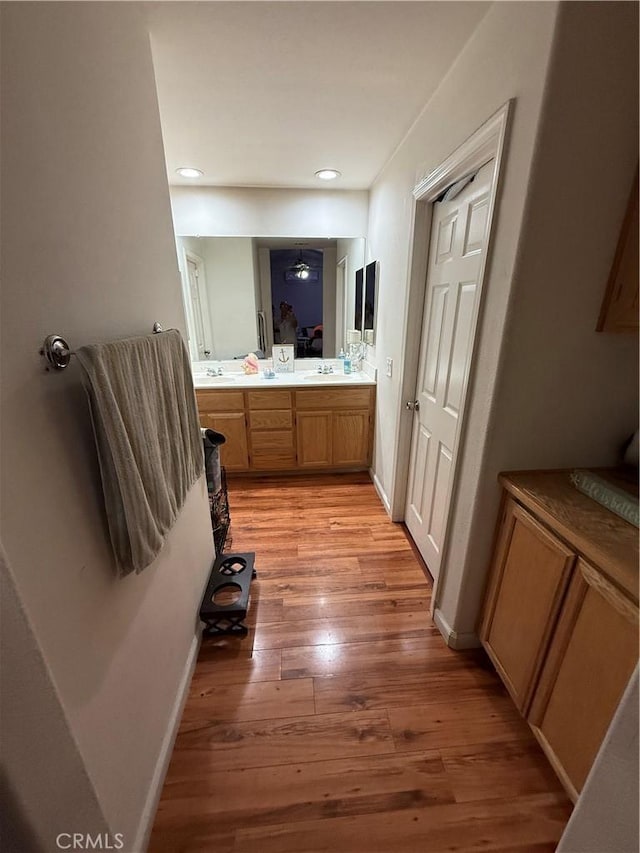 10333 Mendicino, Victorville, CA 92301 - bathroom featuring wood finished floors, a sink, recessed lighting, and baseboards