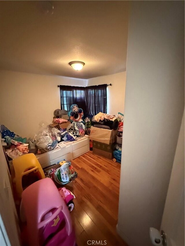 10333 Mendicino, Victorville, CA 92301 - bedroom with wood finished floors and a textured ceiling
