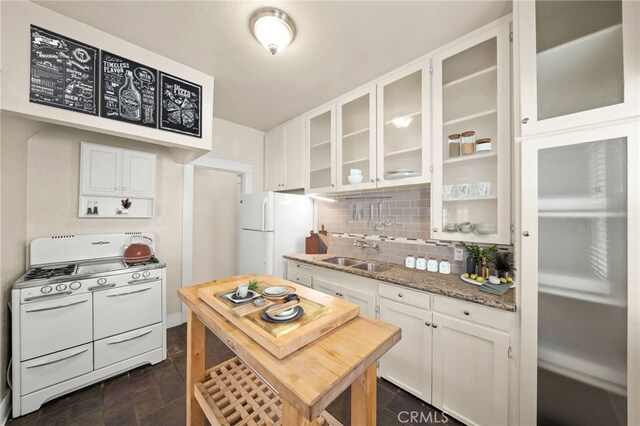 219 Redondo Ave, Long Beach, CA 90803 - kitchen with white appliances, a sink, white cabinetry, decorative backsplash, and glass insert cabinets