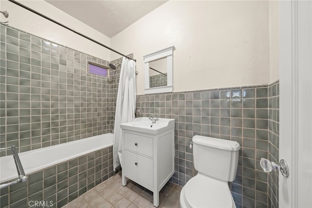 219 Redondo Ave, Long Beach, CA 90803 - full bath with toilet, tiled shower / bath combo, vanity, tile patterned floors, and tile walls