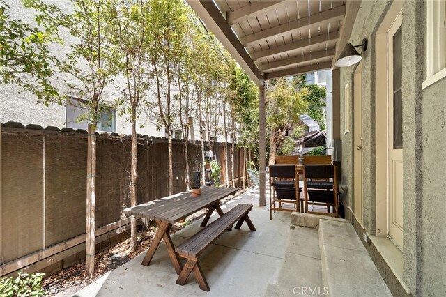 219 Redondo Ave, Long Beach, CA 90803 - fenced backyard with outdoor dining space and a patio