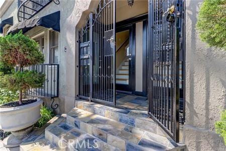 219 Redondo Ave, Long Beach, CA 90803 - view of exterior entry with a gate