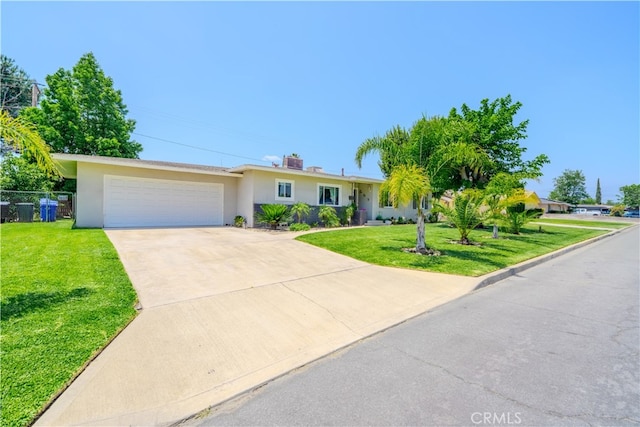 1016 N Marcella Ave, Rialto, CA 92376 - single story home with stucco siding, driveway, and a garage