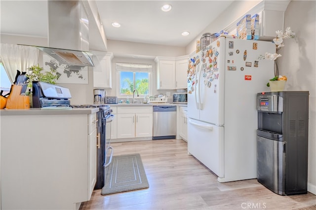 1016 N Marcella Ave, Rialto, CA 92376 - kitchen featuring appliances with stainless steel finishes, a sink, white cabinetry, light wood-type flooring, and light countertops