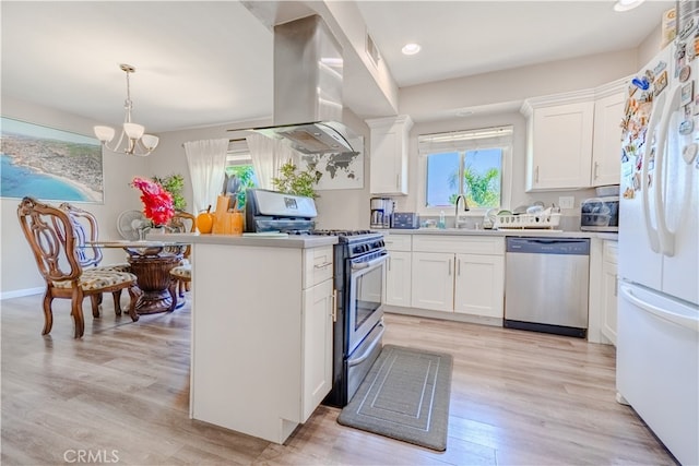1016 N Marcella Ave, Rialto, CA 92376 - kitchen with appliances with stainless steel finishes, island range hood, a chandelier, white cabinets, and recessed lighting