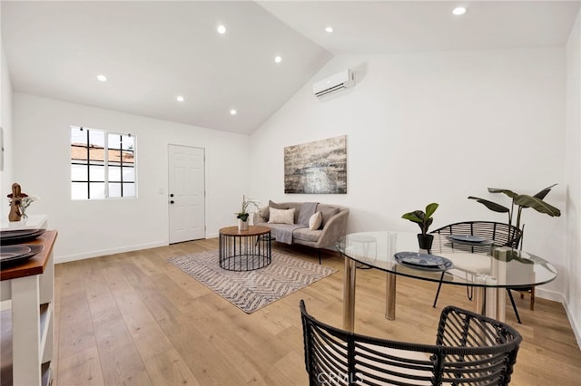 505 N Avon St, Burbank, CA 91505 - living room with an AC wall unit, light wood finished floors, recessed lighting, high vaulted ceiling, and baseboards
