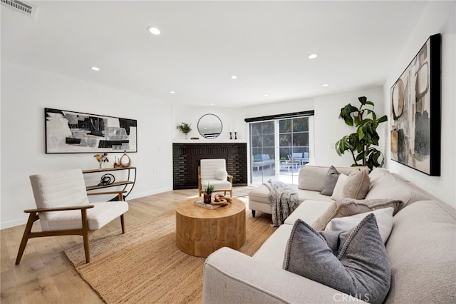 505 N Avon St, Burbank, CA 91505 - living area with light wood-style flooring, recessed lighting, baseboards, and a brick fireplace