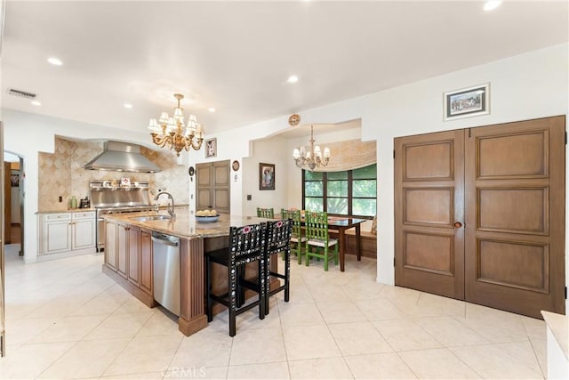 1422 Recado Rd, La Habra Heights, CA 90631 - kitchen with a chandelier, wall chimney exhaust hood, appliances with stainless steel finishes, a sink, and recessed lighting