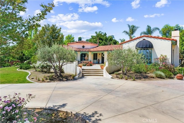 1422 Recado Rd, La Habra Heights, CA 90631 - mediterranean / spanish home with a tiled roof, a chimney, and stucco siding