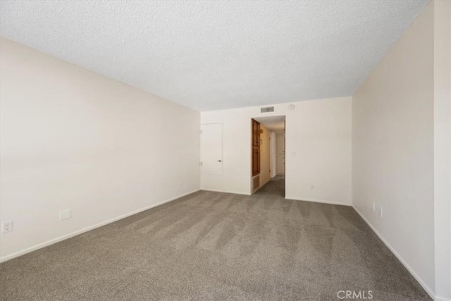 1750 Prefumo Canyon Rd Unit 17, San Luis Obispo, CA 93405 - carpeted empty room featuring a textured ceiling and baseboards