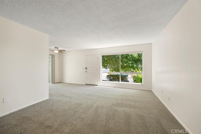 1750 Prefumo Canyon Rd Unit 17, San Luis Obispo, CA 93405 - spare room featuring carpet floors, a textured ceiling, and ceiling fan