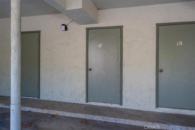1750 Prefumo Canyon Rd Unit 17, San Luis Obispo, CA 93405 - doorway to property featuring stucco siding