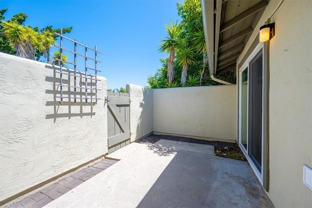 1750 Prefumo Canyon Rd Unit 17, San Luis Obispo, CA 93405 - view of patio featuring a gate