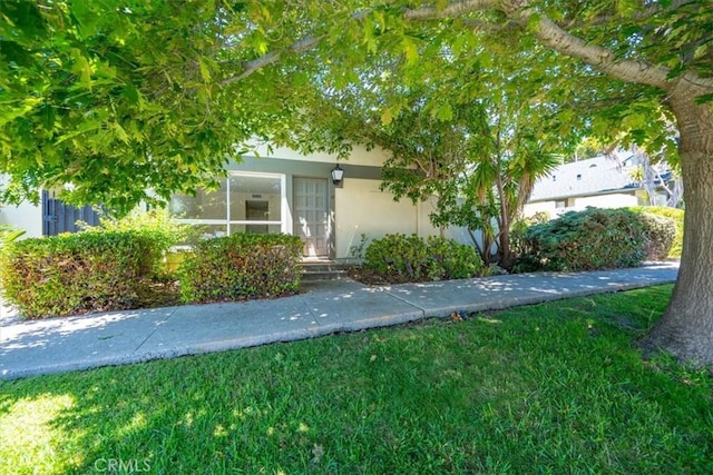 1750 Prefumo Canyon Rd Unit 17, San Luis Obispo, CA 93405 - view of front facade with stucco siding and a front lawn