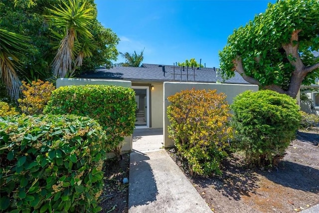 1750 Prefumo Canyon Rd Unit 17, San Luis Obispo, CA 93405 - doorway to property featuring stucco siding