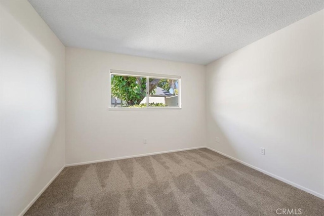 1750 Prefumo Canyon Rd Unit 17, San Luis Obispo, CA 93405 - spare room with carpet and a textured ceiling