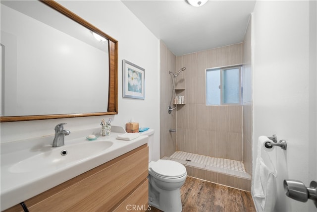 23929 Sunset Crossing Rd, Diamond Bar, CA 91765 - bathroom with toilet, vanity, tiled shower, and wood finished floors