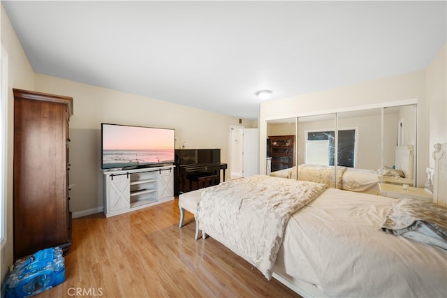 23929 Sunset Crossing Rd, Diamond Bar, CA 91765 - bedroom with light wood-style floors, baseboards, and a closet