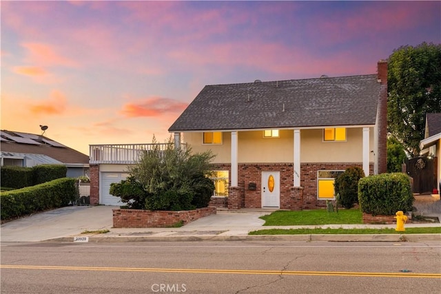 23929 Sunset Crossing Rd, Diamond Bar, CA 91765 - view of front facade featuring concrete driveway, stucco siding, brick siding, and a shingled roof