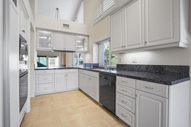 4074 Avenida Brisa, Rancho Santa Fe, CA 92091 - kitchen featuring black appliances, white cabinets, glass insert cabinets, a towering ceiling, and dark stone countertops