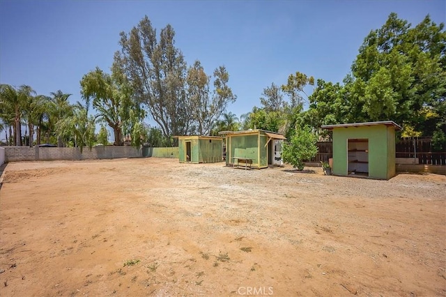 6391 Stearns St, Riverside, CA 92504 - fenced backyard featuring exterior structure and an outdoor structure