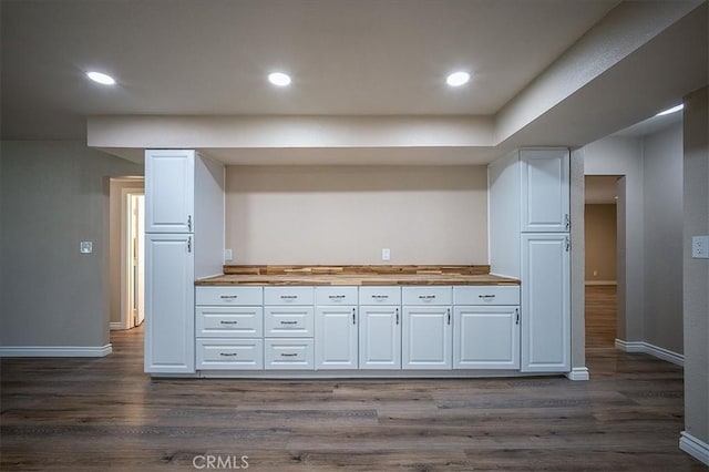 6391 Stearns St, Riverside, CA 92504 - kitchen with white cabinetry, baseboards, dark wood-style flooring, wood counters, and recessed lighting