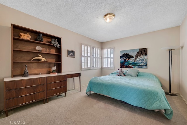 6130 Longridge Ave, Valley Glen, CA 91401 - bedroom with light carpet, a textured ceiling, and baseboards